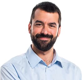 Smiling man with laptop on his laps during presentation